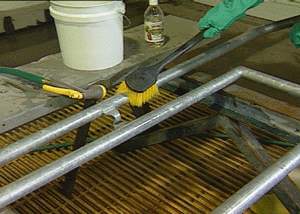 Cleaning the steel surface with a brush