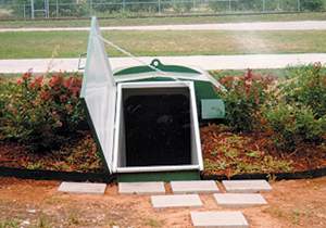 galvanized storm shelter buried in soil